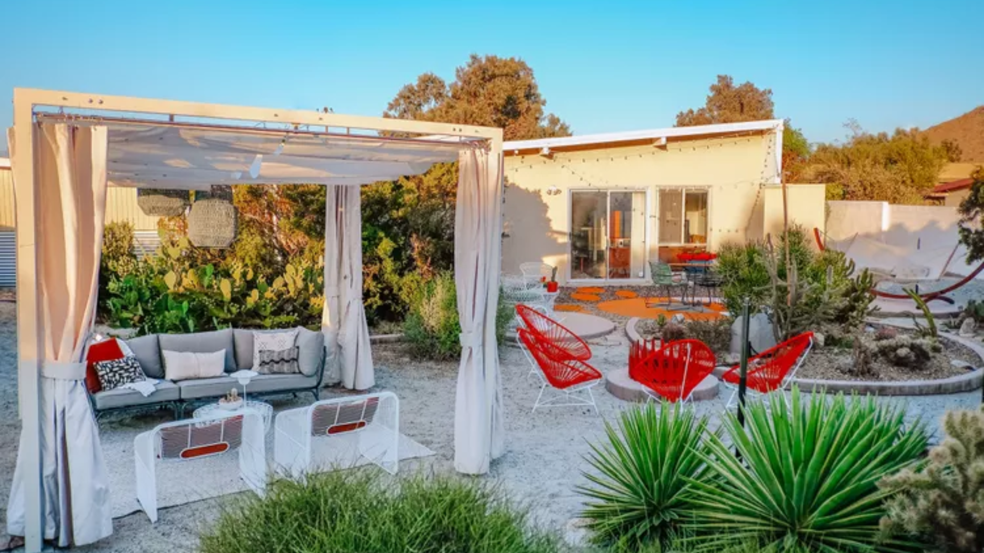 25 Beautiful Pergola Ideas to Add Style, Shade & Comfort to Your Backyard 11 Pergola With Curtains for Shade, Privacy, and Outdoor Zoning
