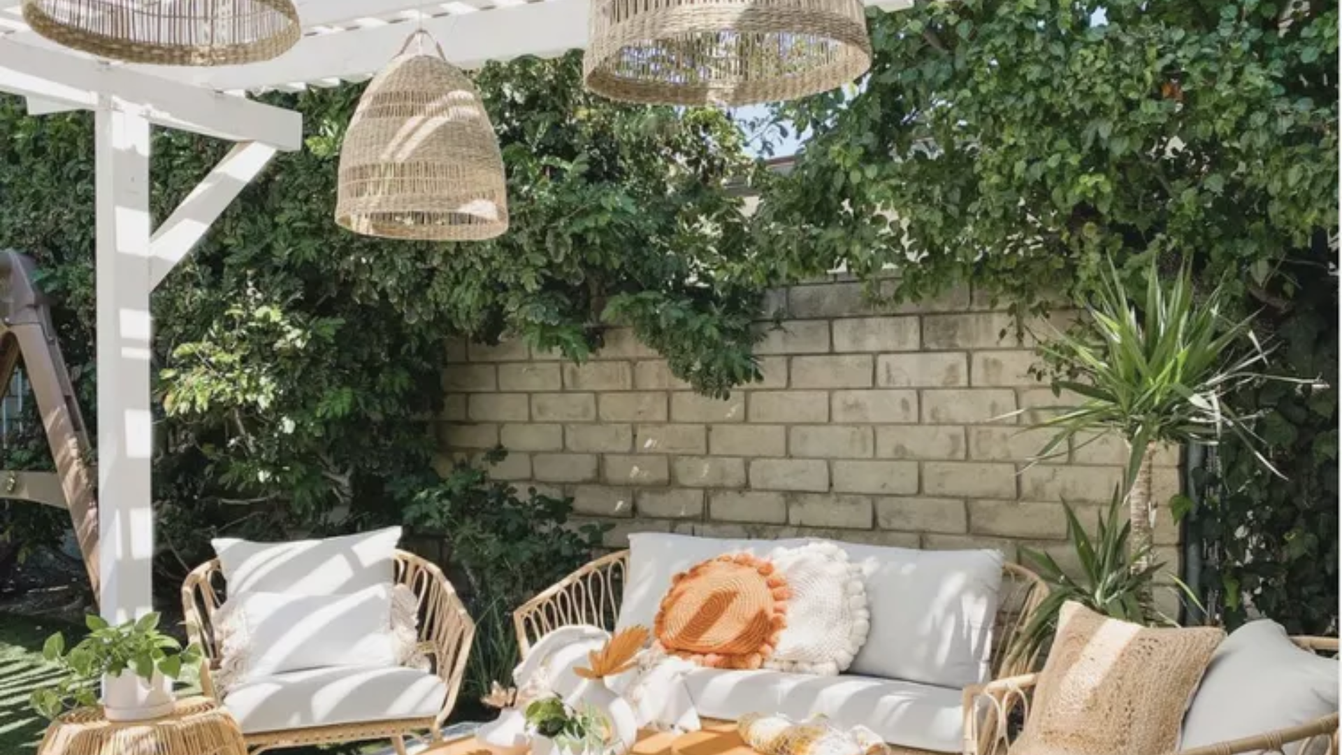 25 Beautiful Pergola Ideas to Add Style, Shade & Comfort to Your Backyard 9 White Pergola with Wicker Accents for an Earthy, Space-Savvy Outdoor Design