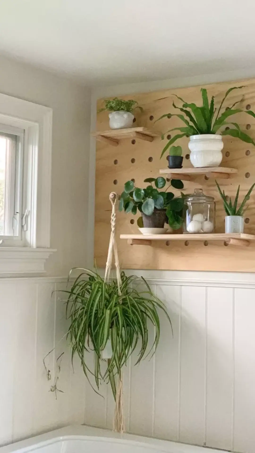 What role do containers play in small-bathroom storage?